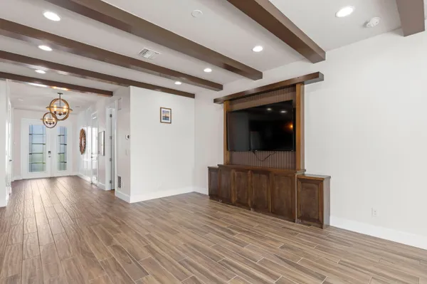 a view of hallway with wooden floor