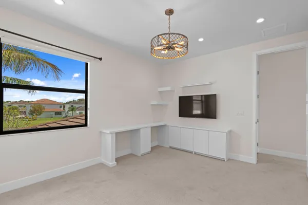 a view of an empty room with a flat screen tv