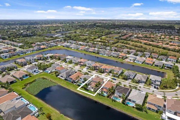 an aerial view of residential houses with outdoor space