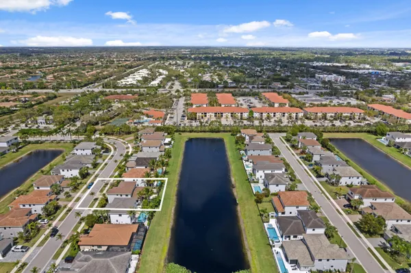 an aerial view of residential building with lake view