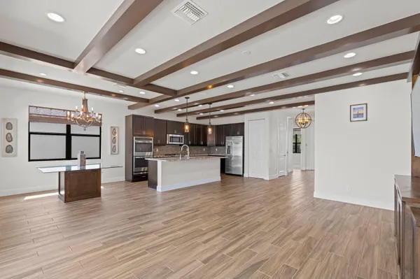 a view of a livingroom with furniture and an empty room
