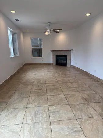 a view of an empty room with a fireplace