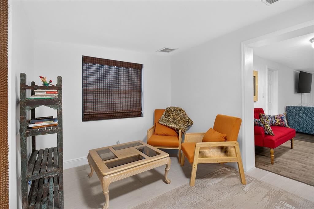 3214 Huntington Road Holiday, FL 34691 - Photo 16 of 26 a bedroom with furniture and a window