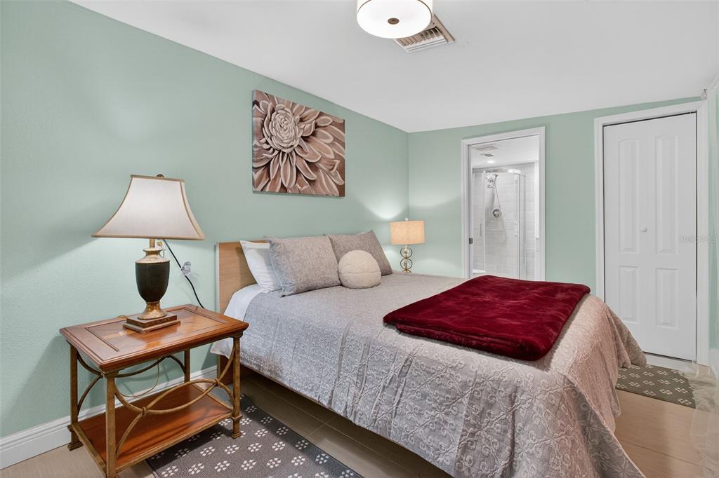 3214 Huntington Road Holiday, FL 34691 - Photo 18 of 26 a bedroom with a bed and a lamp on table