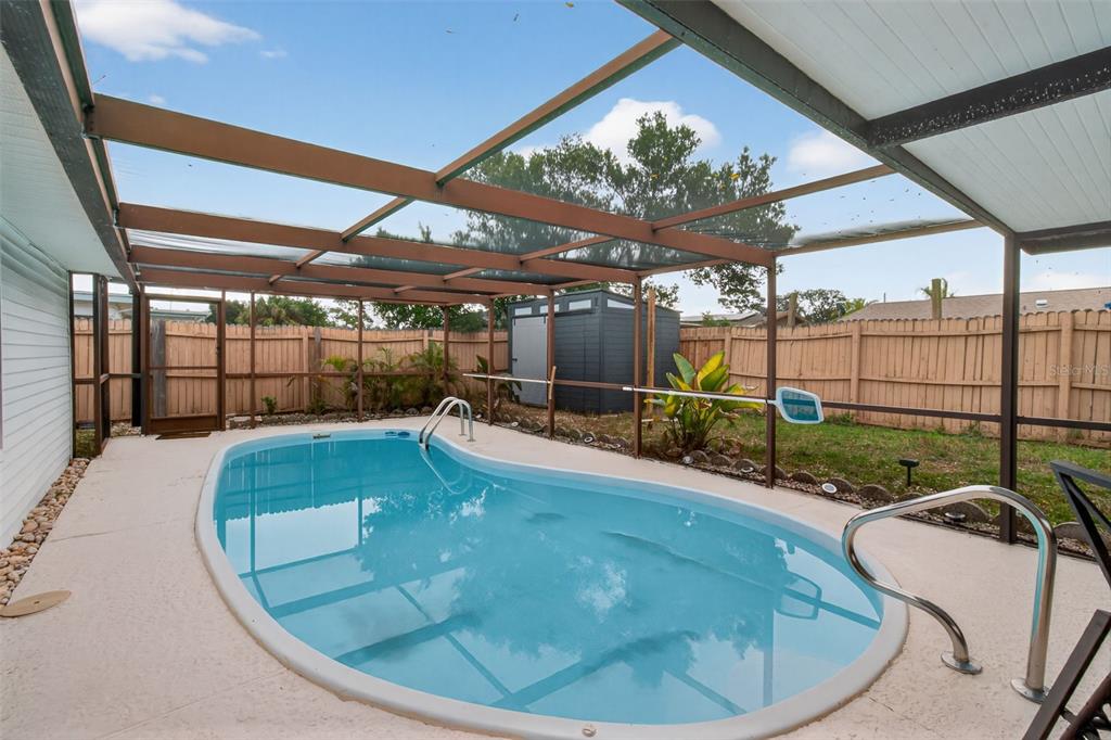 3214 Huntington Road Holiday, FL 34691 - Photo 24 of 26 a view of a swimming pool with a patio