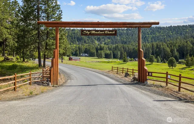 a view of a park with iron fence