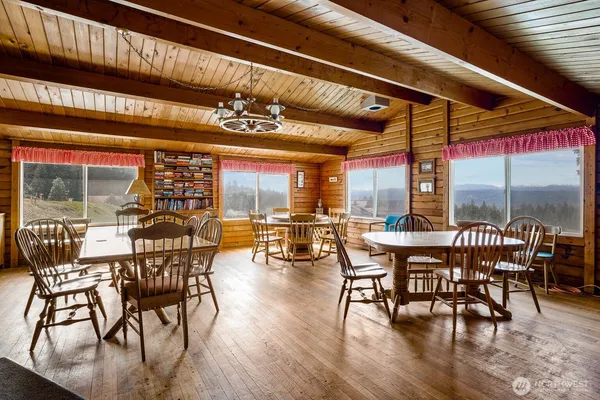 a view of a dining room with furniture window and outside view