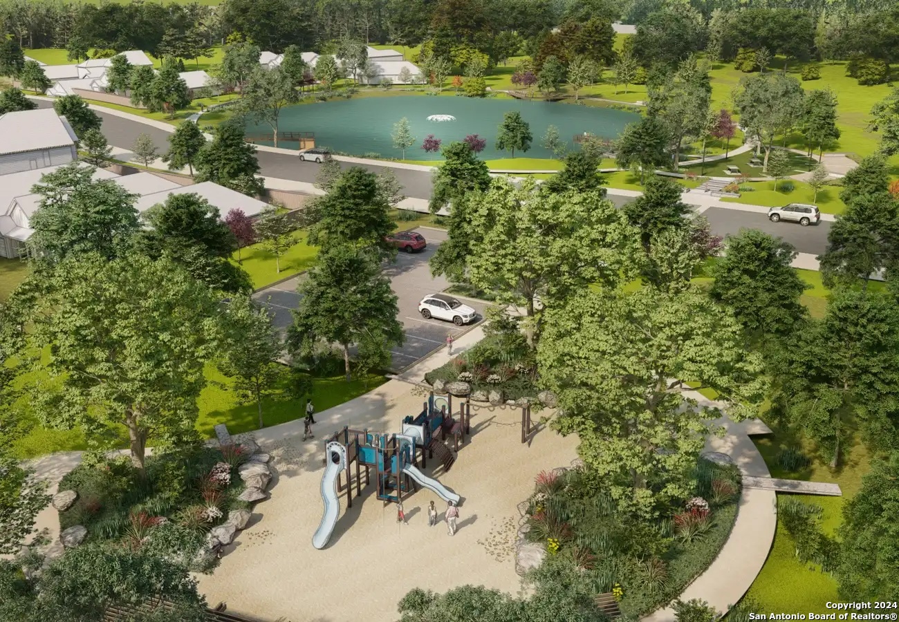 1038 Sharpie Lane Adkins, TX 78101 - Photo 10 of 10 a view of a lake with a yard and mountain view