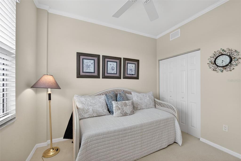 2060 Matecumbe Key Road, Unit 2506 Punta Gorda, FL 33955 - Photo 24 of 38 a bedroom with a bed and a lamp