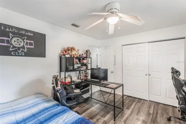 a room with furniture and wooden floor
