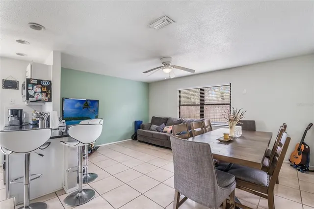 a living room with furniture a window and a table