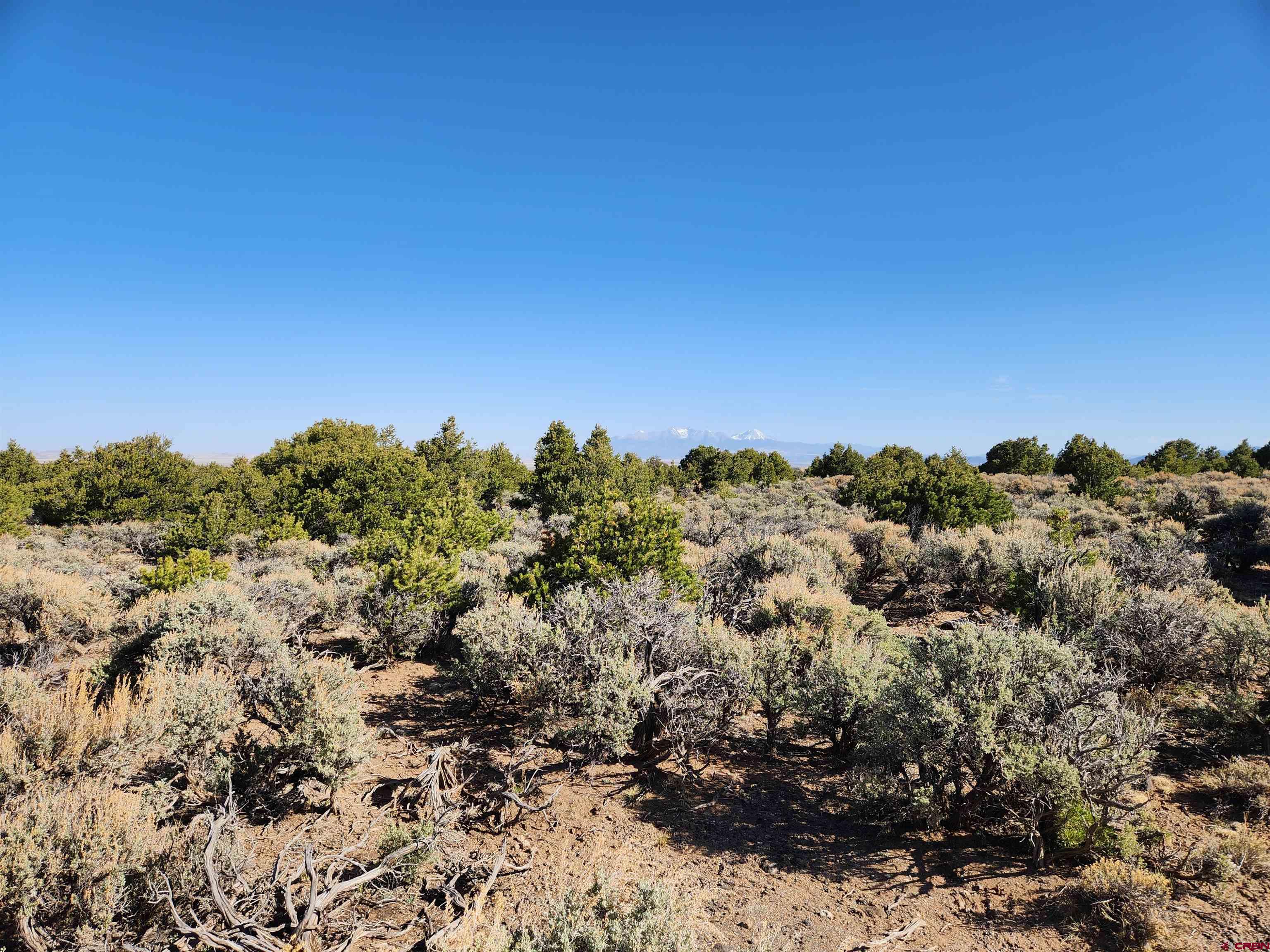 Lot 2-phase Melby Ranch San Luis, CO 81152 - Photo 5 of 6 a view of a large building with a mountain in the background