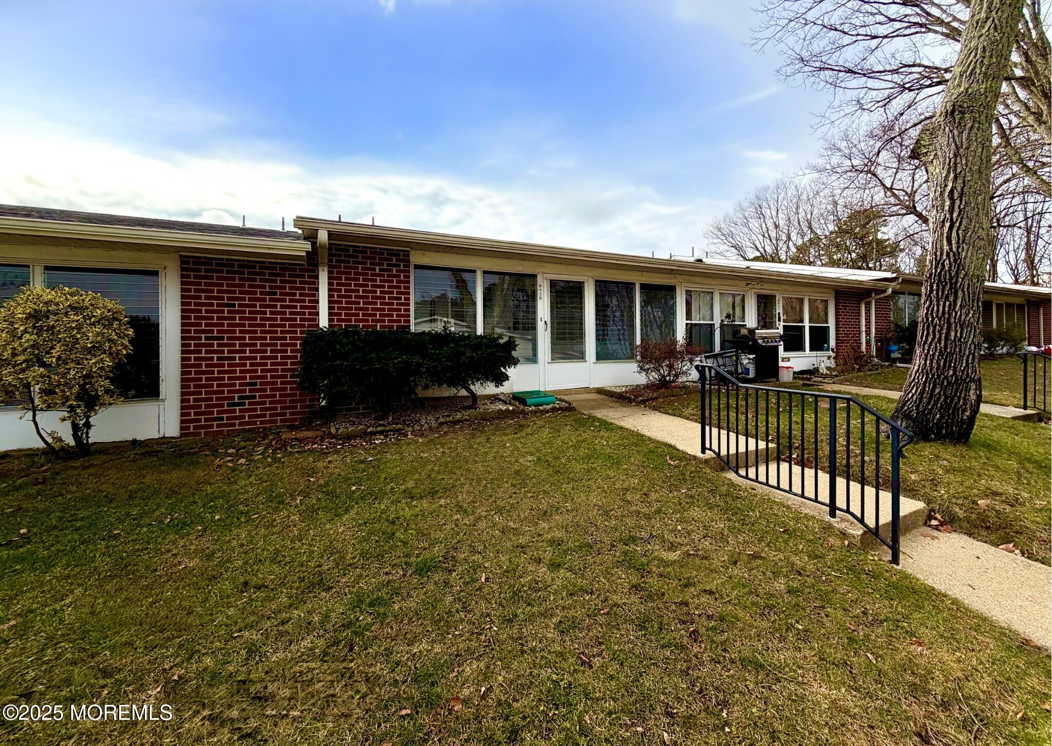 842 B Inverness Court Lakewood, NJ 08701 - Photo 17 of 18 a house view with a garden space