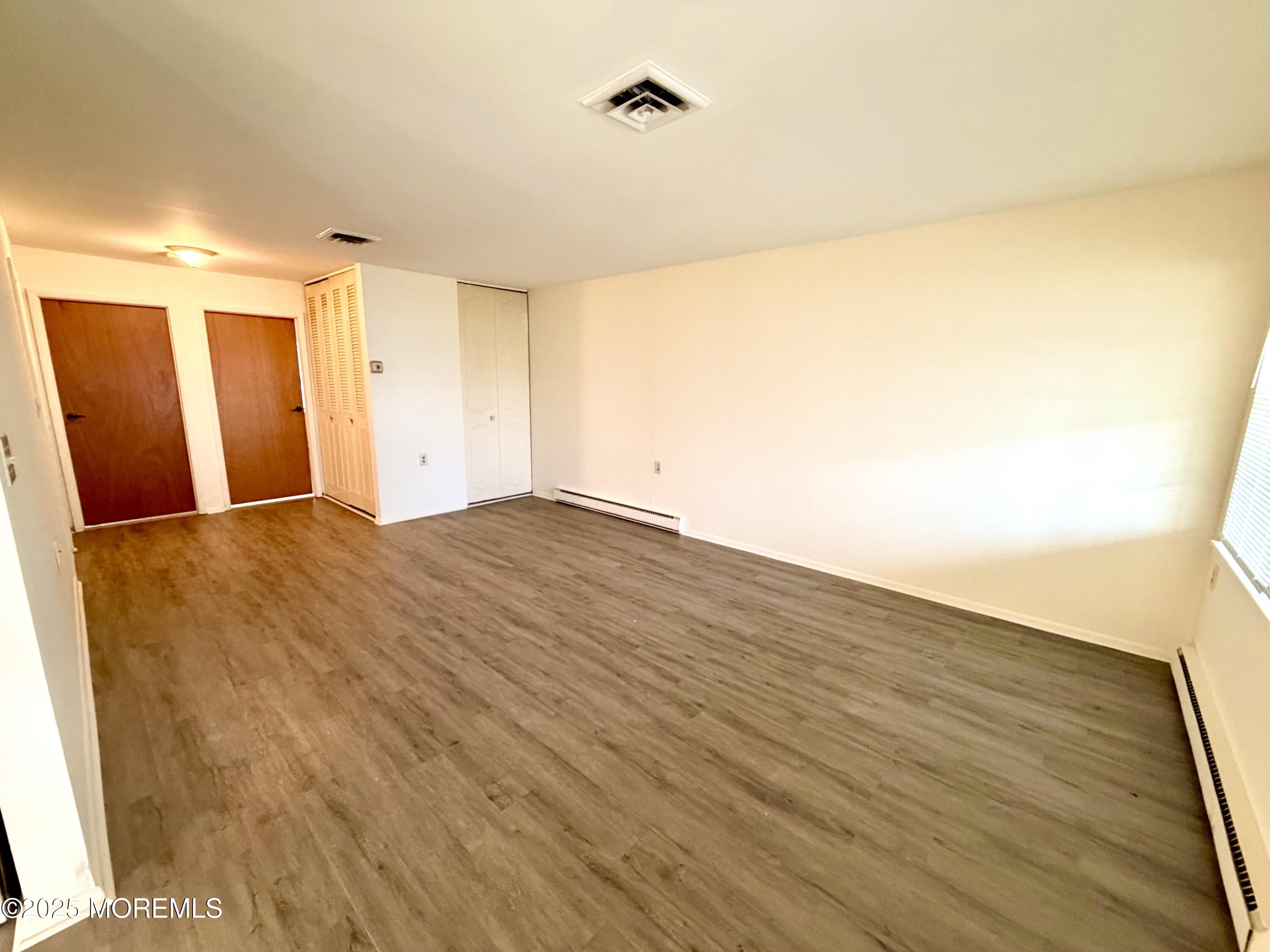 842 B Inverness Court Lakewood, NJ 08701 - Photo 4 of 18 a view of an empty room