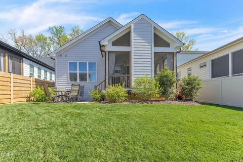 a view of a house with a yard and plants