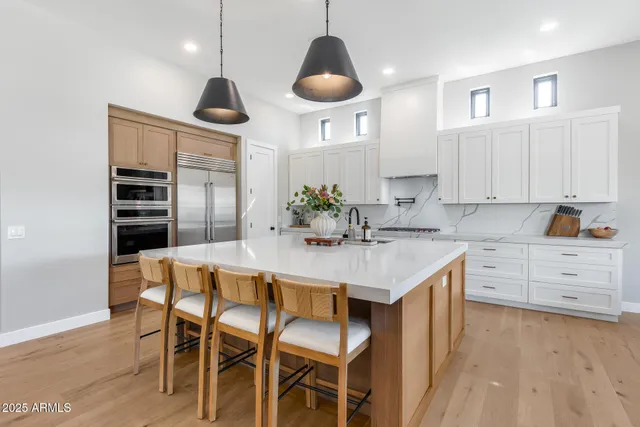 a living room with furniture fireplace and window