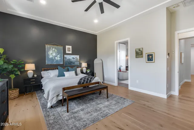 a kitchen with white cabinets and a potted plant