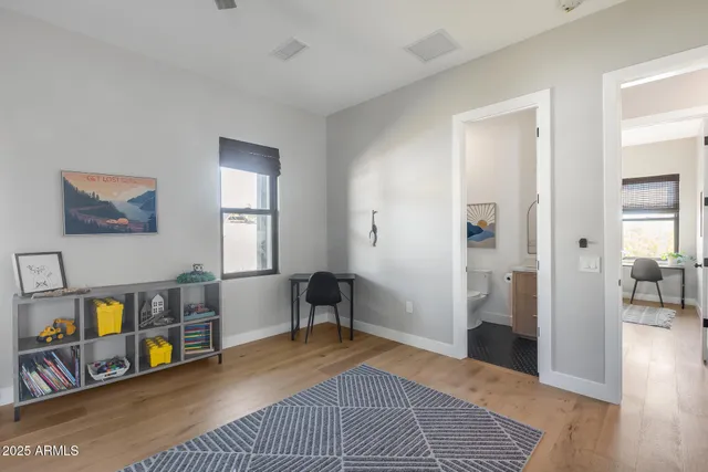 a view of a backyard with plants and outdoor seating