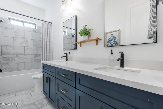 an aerial view of a house with a yard and lake view