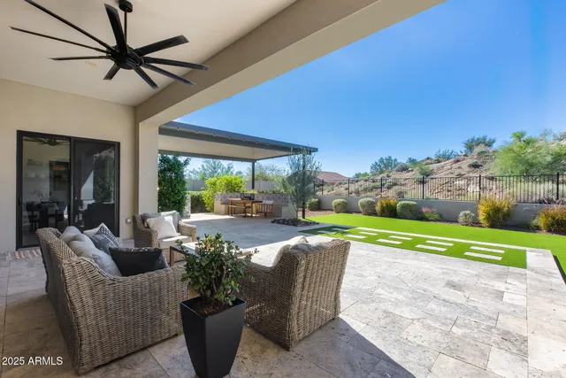 an aerial view of a house with a big yard
