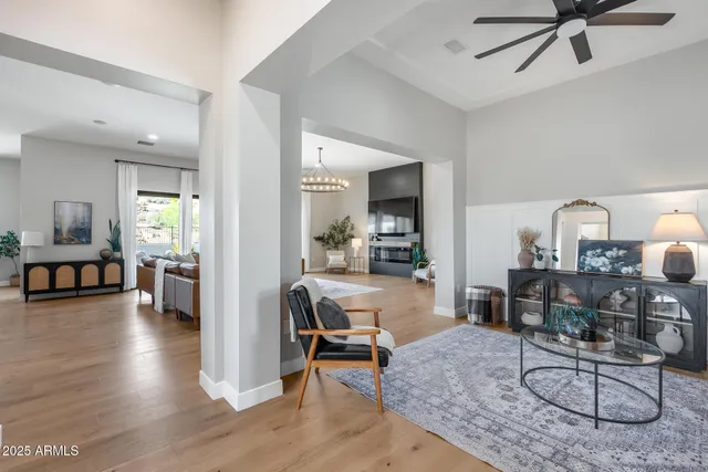 a dining room with furniture window entryway and wooden floor