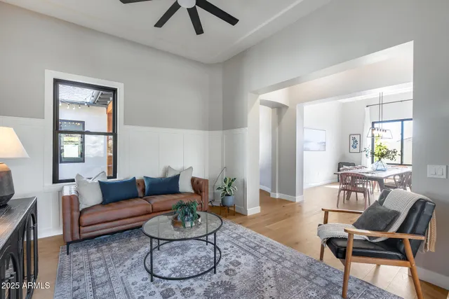 a dining room with a table chairs and entryway