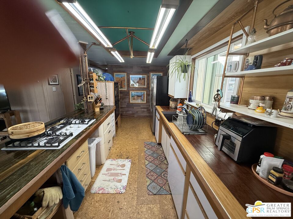 18131 Langlois Road, Unit H1 Desert Hot Springs, CA 92241 - Photo 13 of 44 a kitchen with lots of counter top space