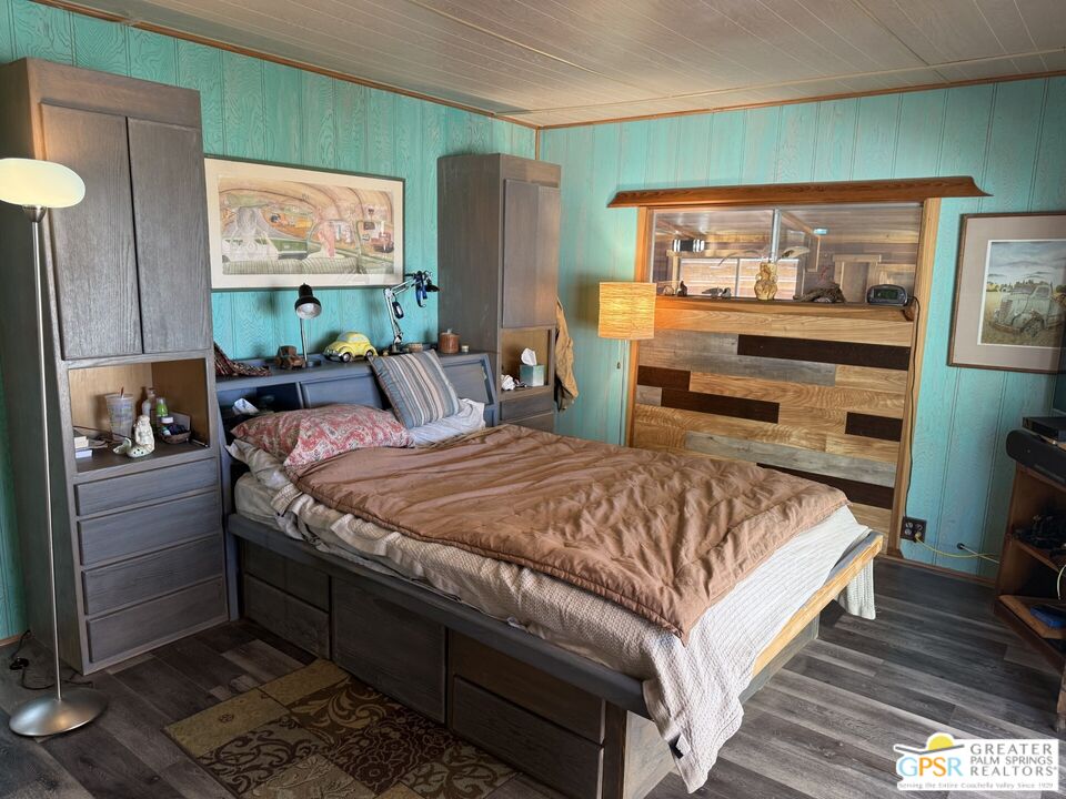 18131 Langlois Road, Unit H1 Desert Hot Springs, CA 92241 - Photo 17 of 44 a bedroom with a bed and a television