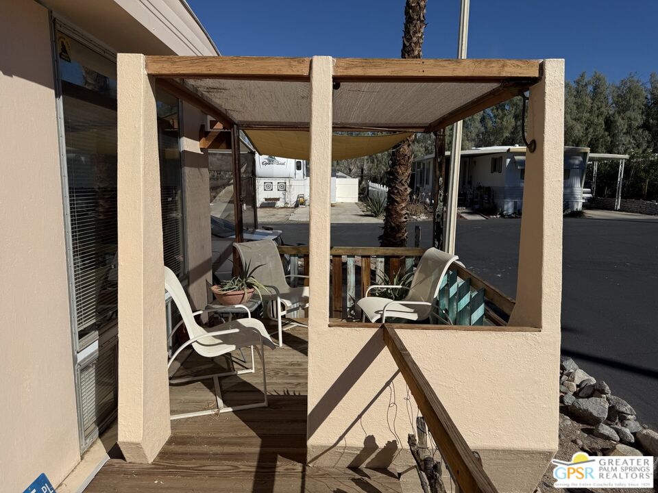 18131 Langlois Road, Unit H1 Desert Hot Springs, CA 92241 - Photo 32 of 44 a view of living room with porch and wooden floor