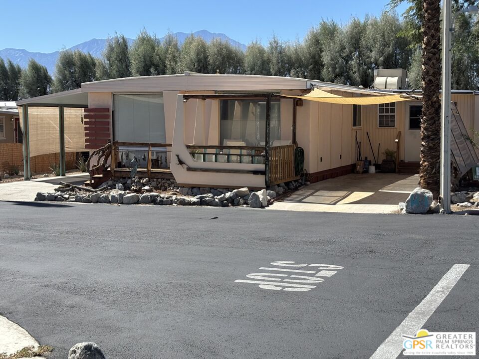 18131 Langlois Road, Unit H1 Desert Hot Springs, CA 92241 - Photo 33 of 44 a view of a street with of house