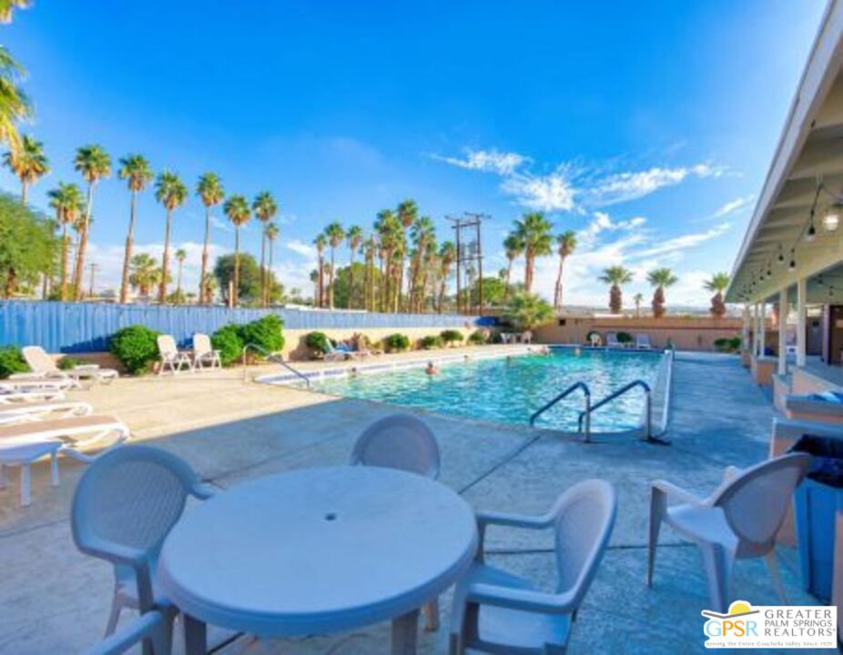 18131 Langlois Road, Unit H1 Desert Hot Springs, CA 92241 - Photo 35 of 44 a view of a chairs and table in patio