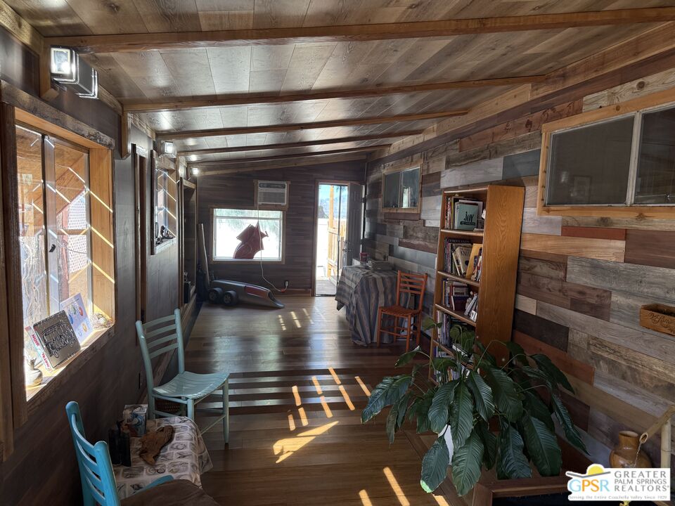 18131 Langlois Road, Unit H1 Desert Hot Springs, CA 92241 - Photo 4 of 44 a lobby with furniture and a potted plant
