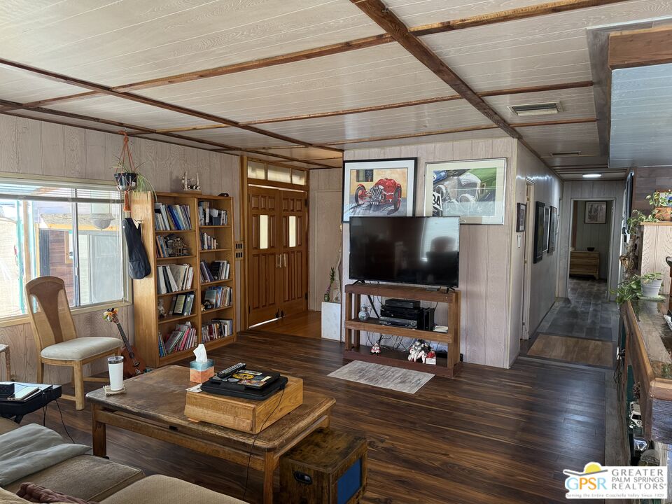 18131 Langlois Road, Unit H1 Desert Hot Springs, CA 92241 - Photo 6 of 44 a living room with furniture and a flat screen tv