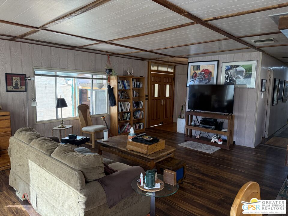 18131 Langlois Road, Unit H1 Desert Hot Springs, CA 92241 - Photo 7 of 44 a living room with furniture and a flat screen tv