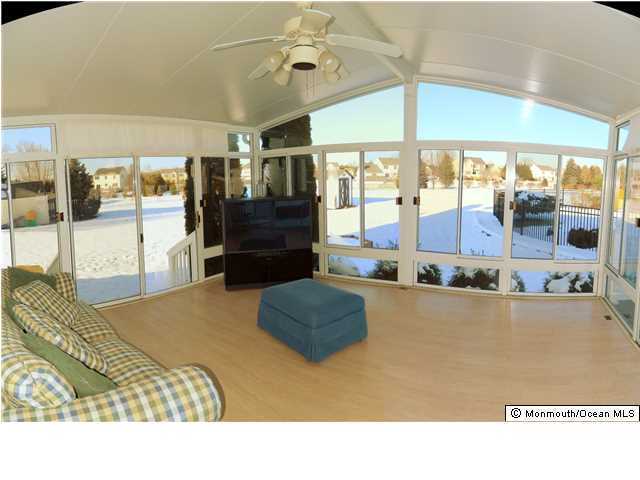 344 Fieldcrest Drive New Egypt, NJ 08533 - Photo 14 of 17 a living room with a bed furniture and large window