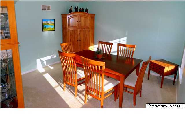 344 Fieldcrest Drive New Egypt, NJ 08533 - Photo 4 of 17 a balcony with table and chairs