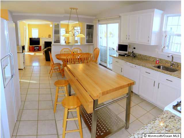 344 Fieldcrest Drive New Egypt, NJ 08533 - Photo 6 of 17 a living room with stainless steel appliances kitchen island granite countertop lots of counter top space and windows