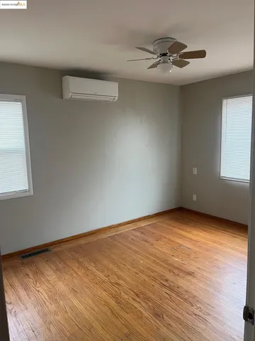 a view of an empty room and a window