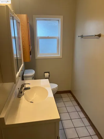 a kitchen with stainless steel appliances granite countertop a sink a refrigerator and a stove