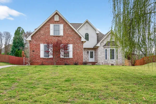 a view of an entryway with wooden floor and a livingroom