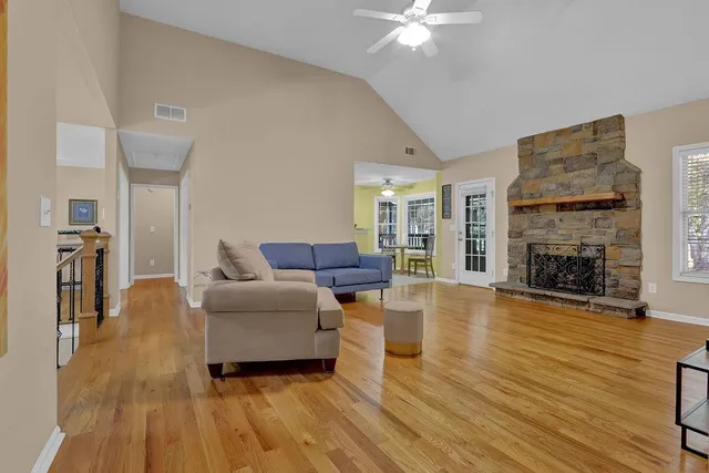 a living room with furniture and a fireplace