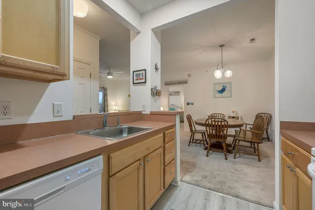 a kitchen with a sink cabinets and appliances