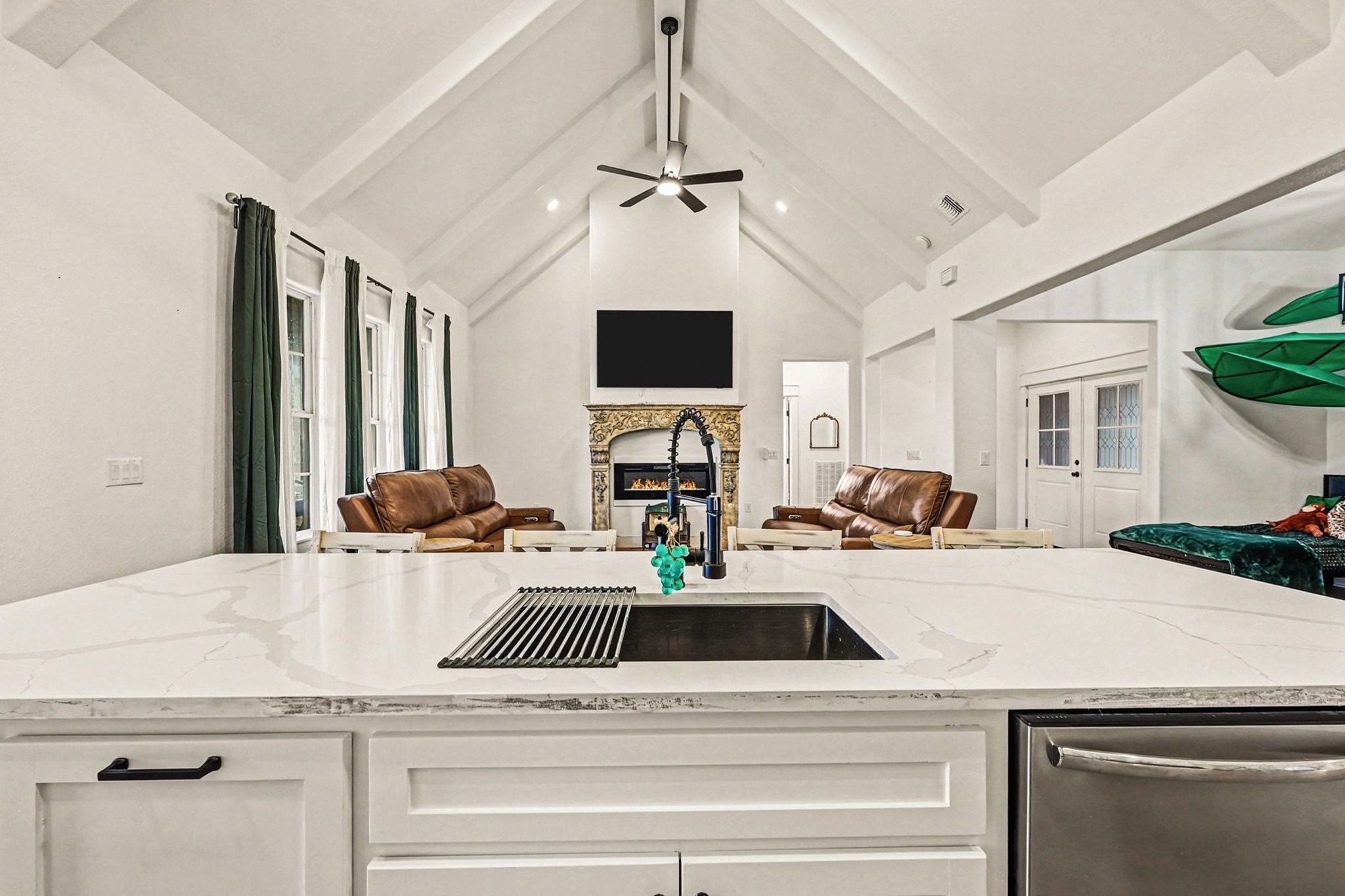 444 Mill Road Angleton, TX 77515 - Photo 11 of 31 a view of a kitchen with a sink dishwasher a dining table and chairs with wooden floor