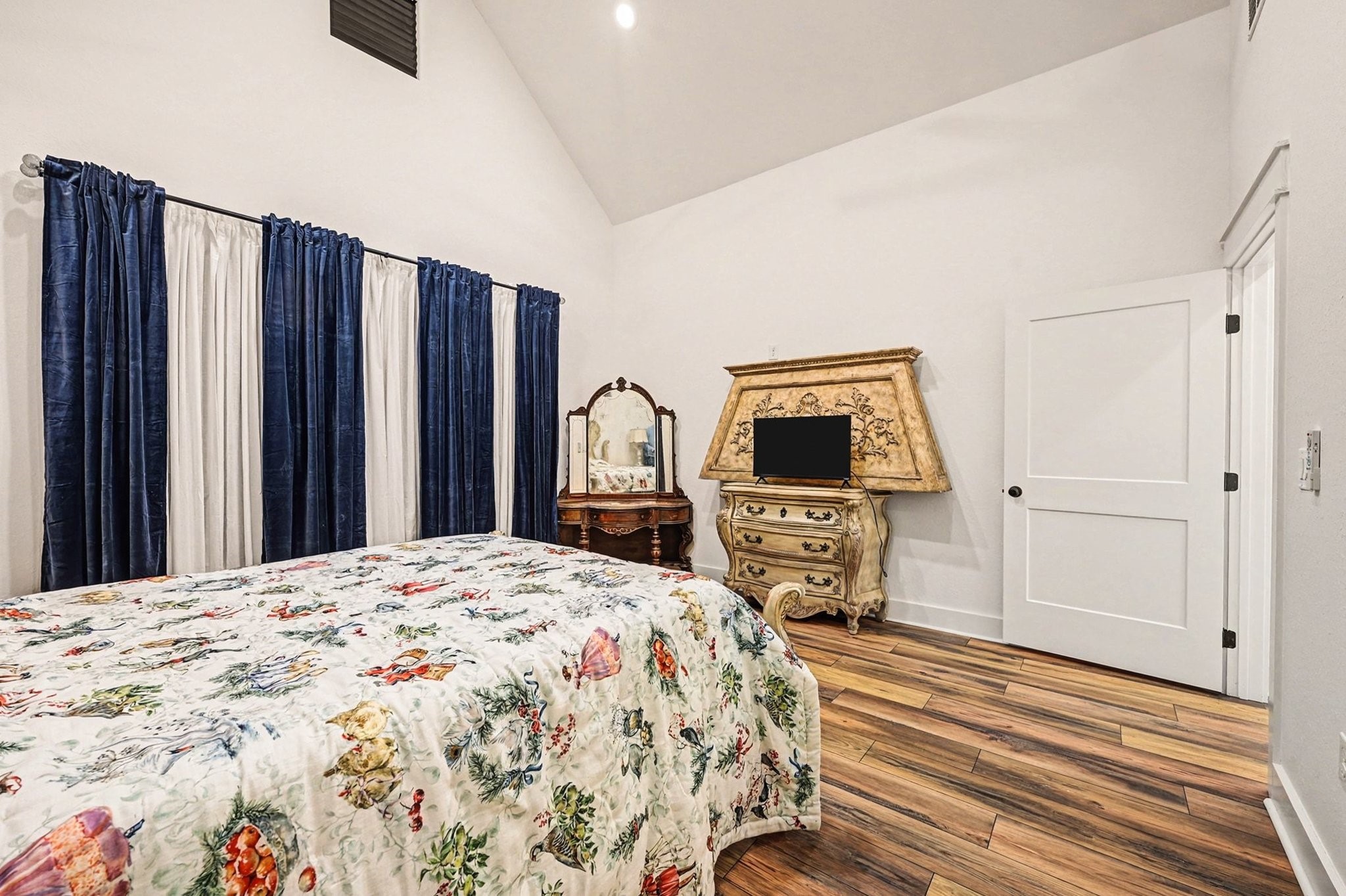 444 Mill Road Angleton, TX 77515 - Photo 15 of 31 a bedroom with a bed and a flat screen tv