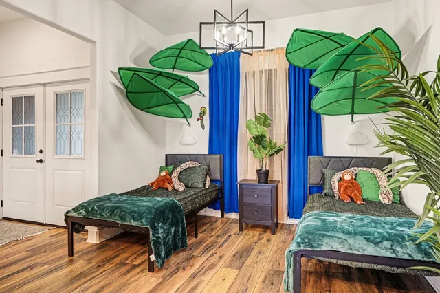 a living room filled with furniture and a wooden floor