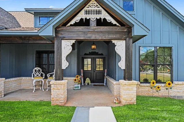 a front view of a house with garden