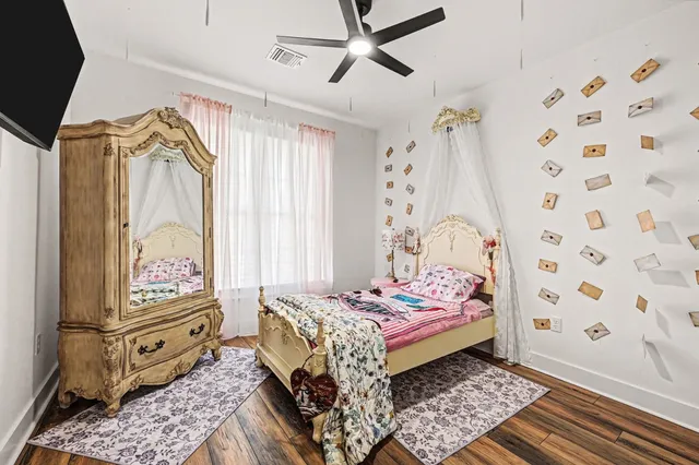 a bedroom with a bed and a window