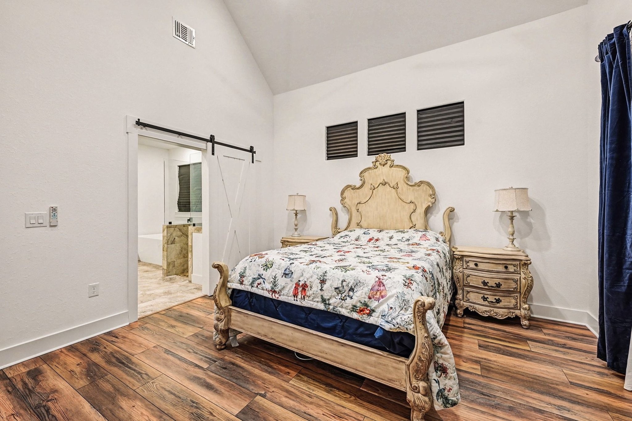 444 Mill Road Angleton, TX 77515 - Photo 22 of 31 a bedroom with a bed and wooden floor