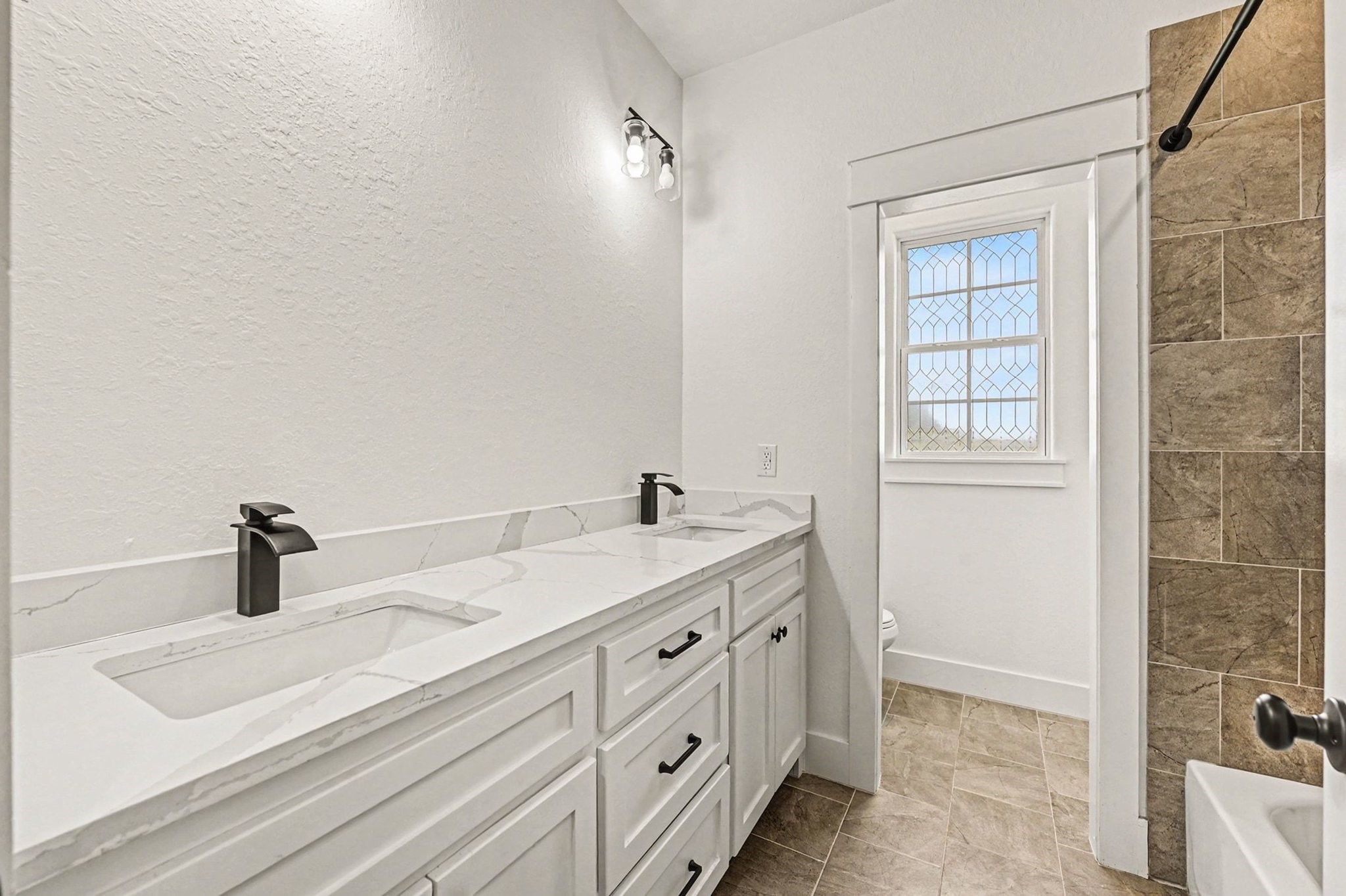 444 Mill Road Angleton, TX 77515 - Photo 25 of 31 a bathroom with a sink and mirror