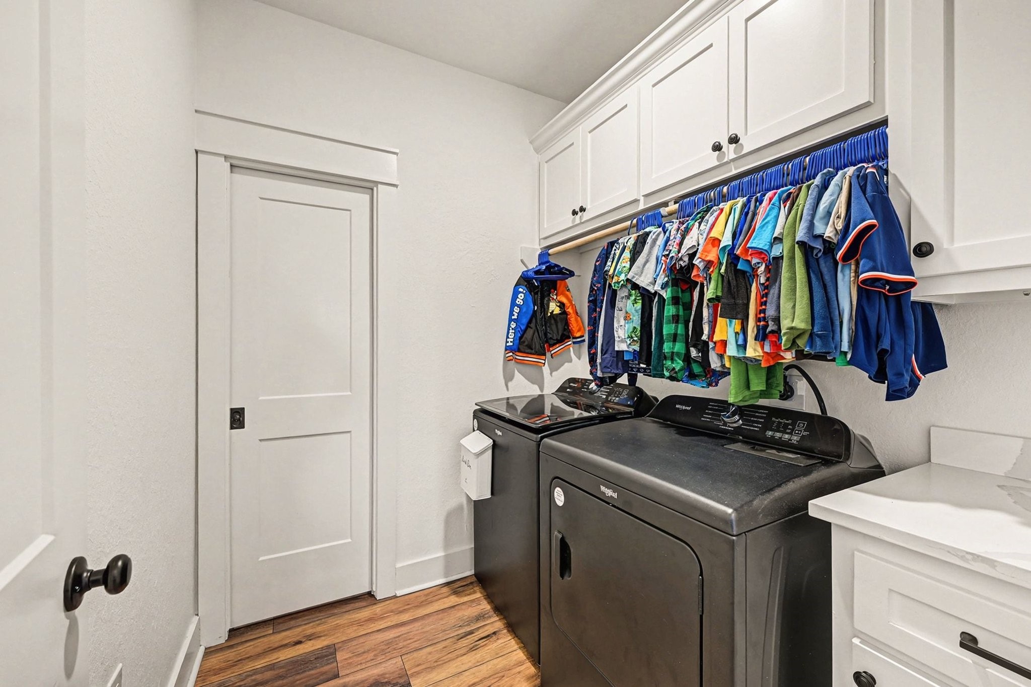 444 Mill Road Angleton, TX 77515 - Photo 27 of 31 a view of walk in closet with clothes and shoes